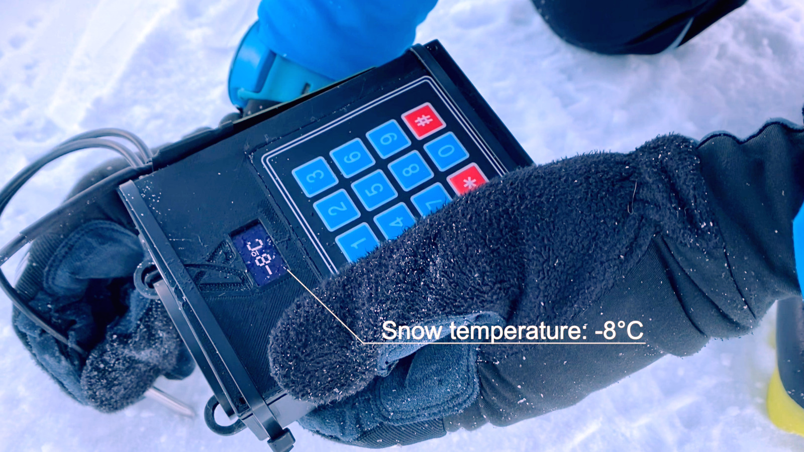 Photo of the ski and snow scanner measuring the snow temperature